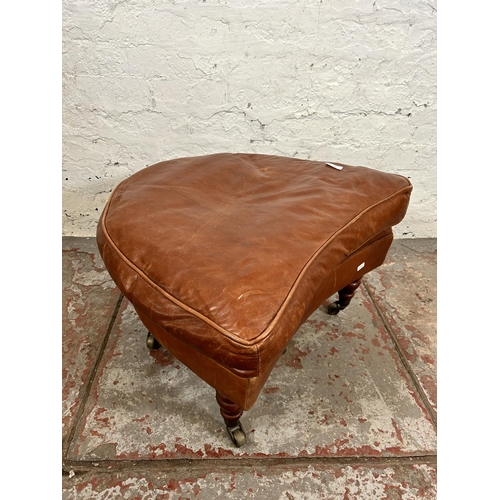 161 - A Gladstone tan leather footstool with brass castors - approx, 42cm high x 63cm wide x 52cm deep