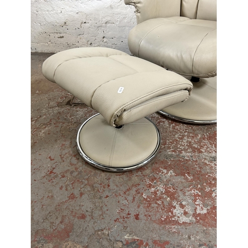 164 - A Global Furniture Alliance Ltd. cream leatherette swivel armchair and footstool