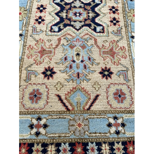 168 - A vintage hand knotted rug - approx. 155cm x 96cm