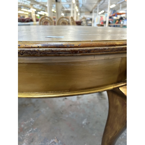 176 - A Georgian style gold painted circular extending dining table with ball and claw supports - approx. ... 