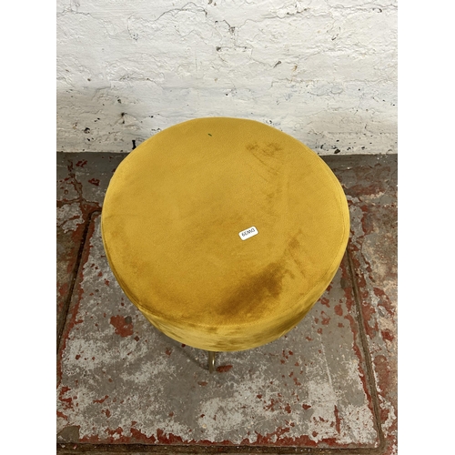 177 - A modern yellow fabric upholstered circular footstool with metal supports - approx. 44cm high x 36 d... 