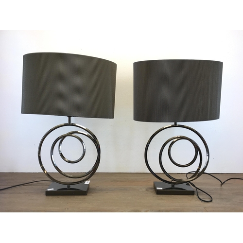 426 - A pair of modern swirl design table lamps with shades - 58cm high including shades