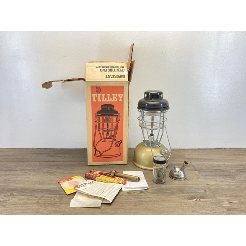 430 - A vintage boxed Tilley X246B Storm Light paraffin lantern with instruction manuals and accessories