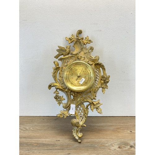 435 - A Rococo style gilded cast metal wall mountable barometer - approx. 50cm long