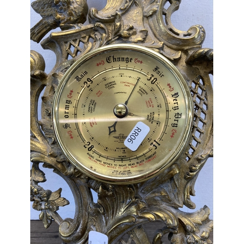 435 - A Rococo style gilded cast metal wall mountable barometer - approx. 50cm long