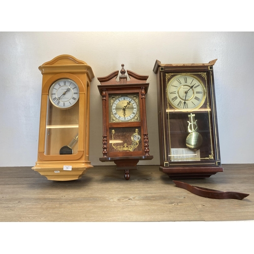 436 - Three wooden cased wall clocks, one Britannia, one London Clock Co. and one President