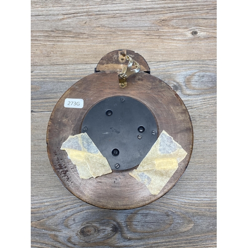 437 - An early/mid 20th century carved wall mountable barometer - approx. 22cm diameter