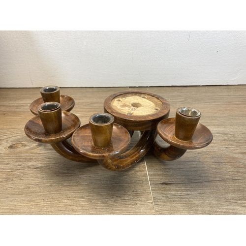 443 - A collection of vintage treenware to include oak candlestick, camel figurine etc. together with two ... 