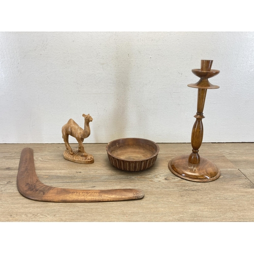 443 - A collection of vintage treenware to include oak candlestick, camel figurine etc. together with two ... 