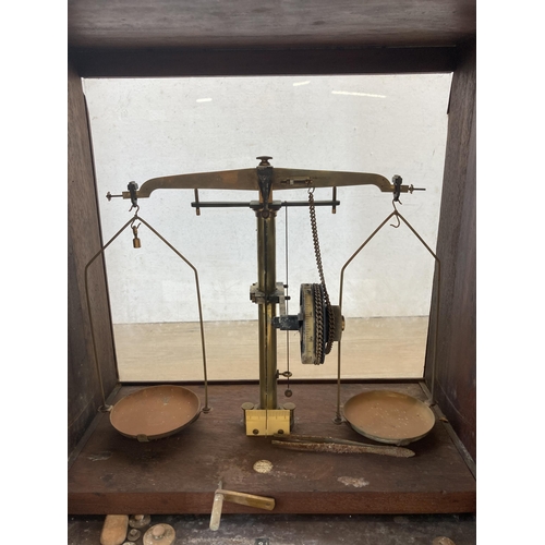 444 - A set of early/mid 20th century oak cased W&T Avery Ltd brass scientific precision scales - approx. ... 