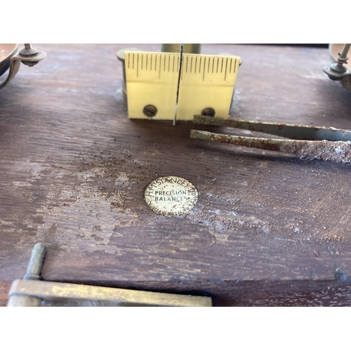 444 - A set of early/mid 20th century oak cased W&T Avery Ltd brass scientific precision scales - approx. ... 