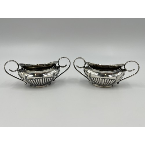 1270 - A pair of Edwardian Walker & Hall hallmarked Sheffield silver twin handled salt cellars, dated 1902 ... 