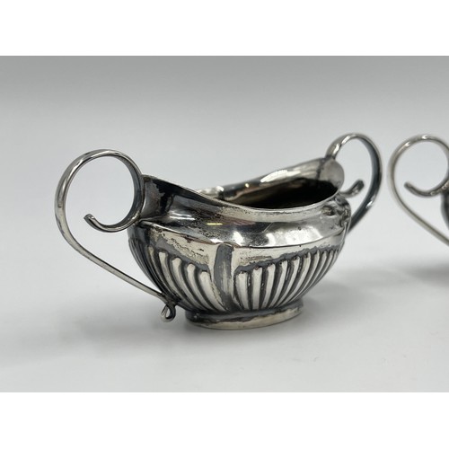 1270 - A pair of Edwardian Walker & Hall hallmarked Sheffield silver twin handled salt cellars, dated 1902 ... 