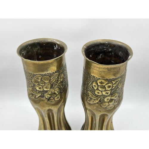 1357 - A pair of WWI Trench Art brass shell case vases, dated 1918 - approx. 29cm high