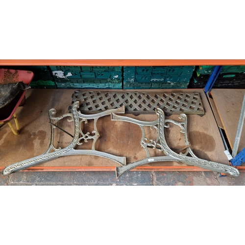 804 - A pair of cast iron garden bench ends and bench back