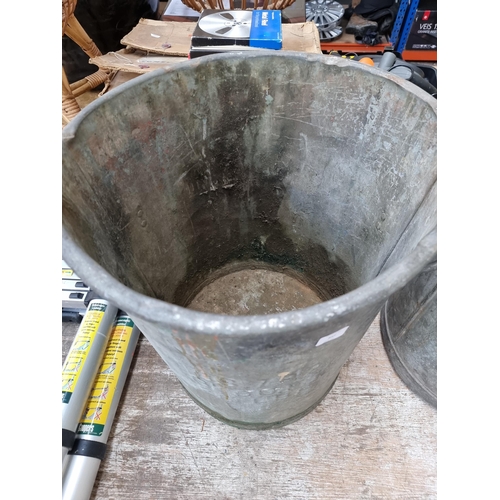 837 - A vintage galvanised twin handled dustbin - approx. 61cm high x 49cm diameter