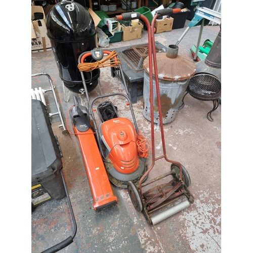 855 - Three garden tools, one vintage Qualcast push mower, one Flymo Hover Vac lawnmower and one Flymo Gar... 