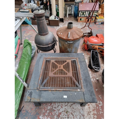 856 - Three garden items, one black metal fire pit - approx. 81cm square, one incinerator and one chimenea