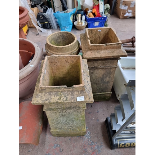 870 - Three cast stone chimney pots - largest approx. 73cm high