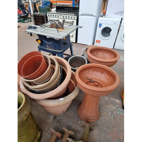 872 - Twenty two various sized garden planters to include plastic terracotta effect, stainless steel etc.