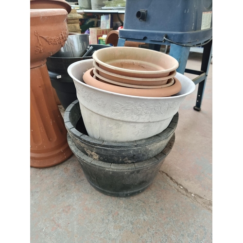 872 - Twenty two various sized garden planters to include plastic terracotta effect, stainless steel etc.