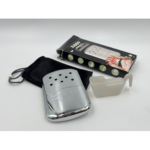 1345 - Three Zippo items, one boxed cigarette lighter, one Premium Lighter Fluid and one outdoors deluxe ha... 