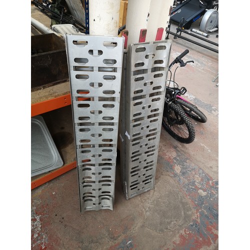 788 - A pair of aluminium folding motorcycle ramps