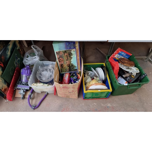 883 - Four boxes containing cut crystal glassware, toys, ceramics, artwork etc.