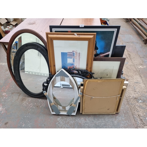 896 - A collection of framed pictures and mirrors