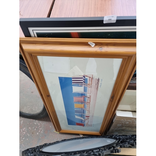 896 - A collection of framed pictures and mirrors