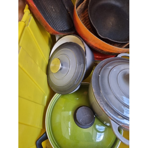 902 - A box containing kitchenware to include two Le Creuset style grey enamel and cast iron lidded casser... 