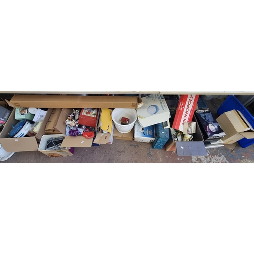 905 - A large quantity of house clearance items to include Monopoly board game, cast metal and green glass... 