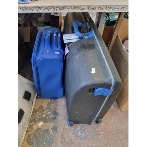 909 - Two boxes and two suitcases containing Scotts Ltd Leg Activator foot exercise machine - model no. LE... 