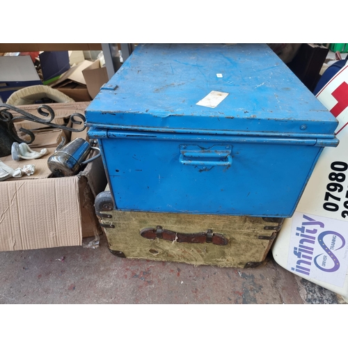 910 - A collection of house clearance items to include blue metal travel trunk, early 20th century canvas ... 