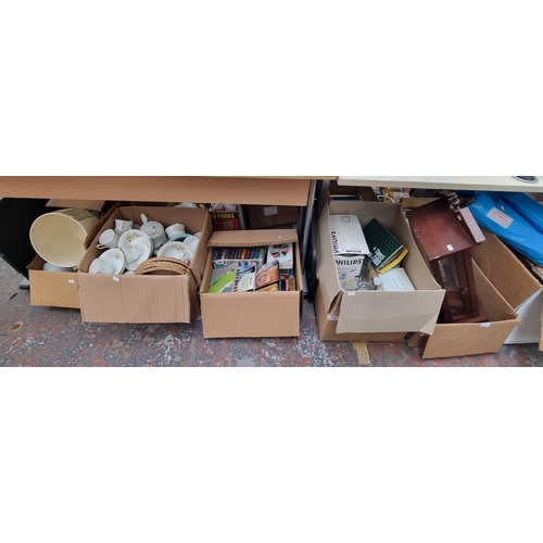 925 - Five boxes containing mahogany cased wall clock, books, Royal Stafford bone china etc.