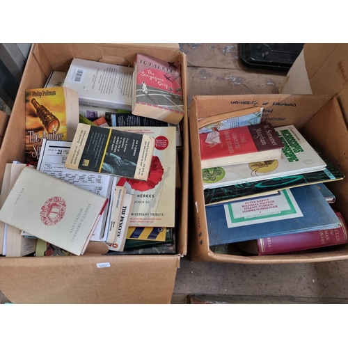 928 - Four boxes containing books, ceramics, pictures, vintage canvas suitcase etc.