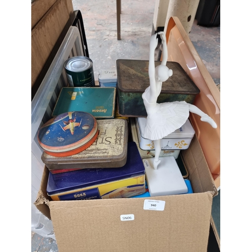 940 - A box containing vintage advertising tins, Enesco Ltd Ballare A6665 white ballerina figurine etc.