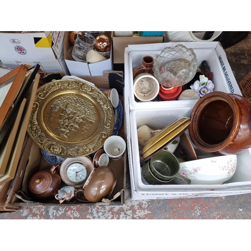 945 - Three boxes containing four wicker baskets, ceramics, brass charger etc.