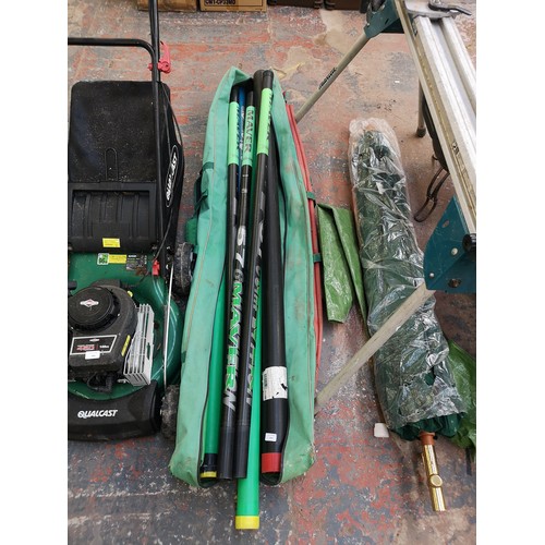 859 - A Maver rod bag containing fishing poles and cases to include Maver Superlitium 57 pole etc.