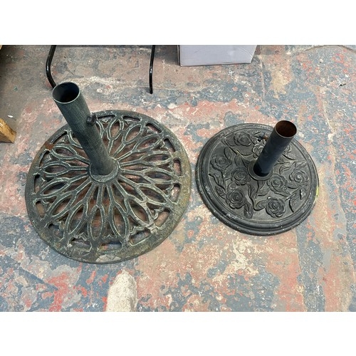 888 - Two cast metal garden parasol bases