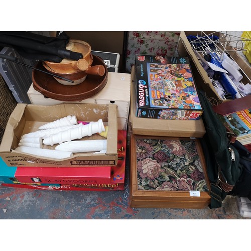 912 - A collection of house clearance items to include board games, dragon fishing rod, ceramics etc.