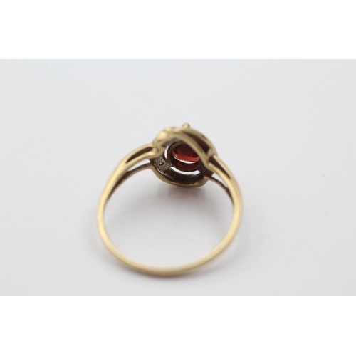 1001 - A 9ct gold teardrop garnet solitaire ring with diamond accents, size R - approx. gross weight 2.4 gr... 