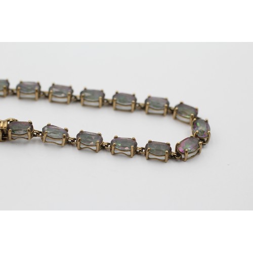 1008 - A 9ct gold mystic topaz fancy link bracelet with diamond set clasp - approx. gross weight 6.1 grams