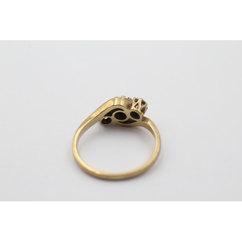 1011 - A 9ct gold diamond and sapphire three stone ring, size L - approx. gross weight 2.1 grams