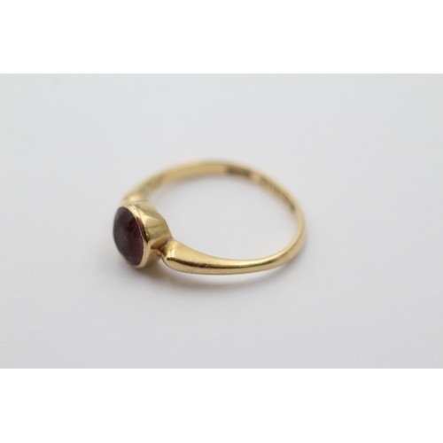 1012 - An 18ct gold round cut amethyst solitaire ring, size N - approx. gross weight 2.5 grams