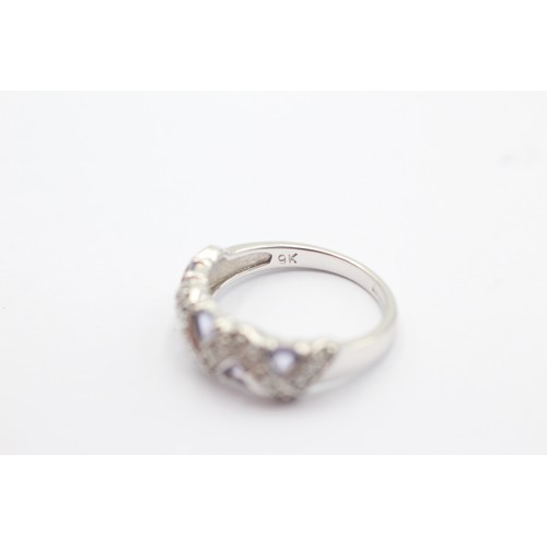 1021 - A 9ct white gold diamond and tanzanite dress ring, size L - approx. gross weight 3.1 grams