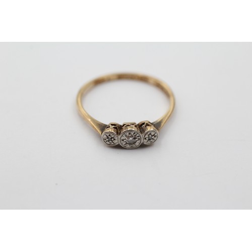 1026 - A 9ct gold diamond three stone ring, size M½ - approx. gross weight 1.5 grams