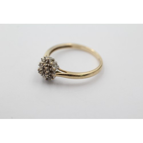 1027 - A 9ct gold diamond halo ring, size P - approx. gross weight 1.8 grams