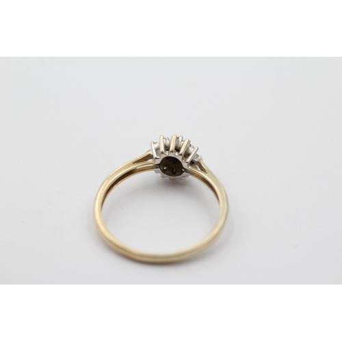 1027 - A 9ct gold diamond halo ring, size P - approx. gross weight 1.8 grams