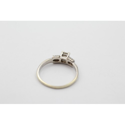 1031 - A 9ct white gold round brilliant cut diamond solitaire ring, size K½ - approx gross weight 1.7 grams